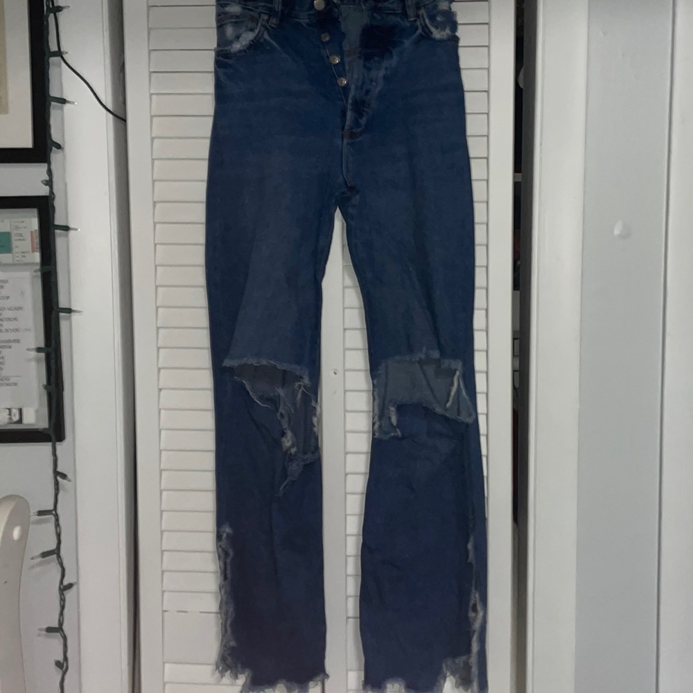 Boot cut denim jeans. Distressed. Size 00